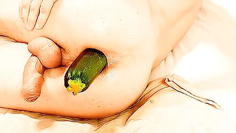 Slut with a sexy ass takes a zucchini to fuck in ass