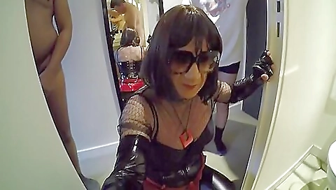 Busty brunette with latex stockings enjoys anal domination